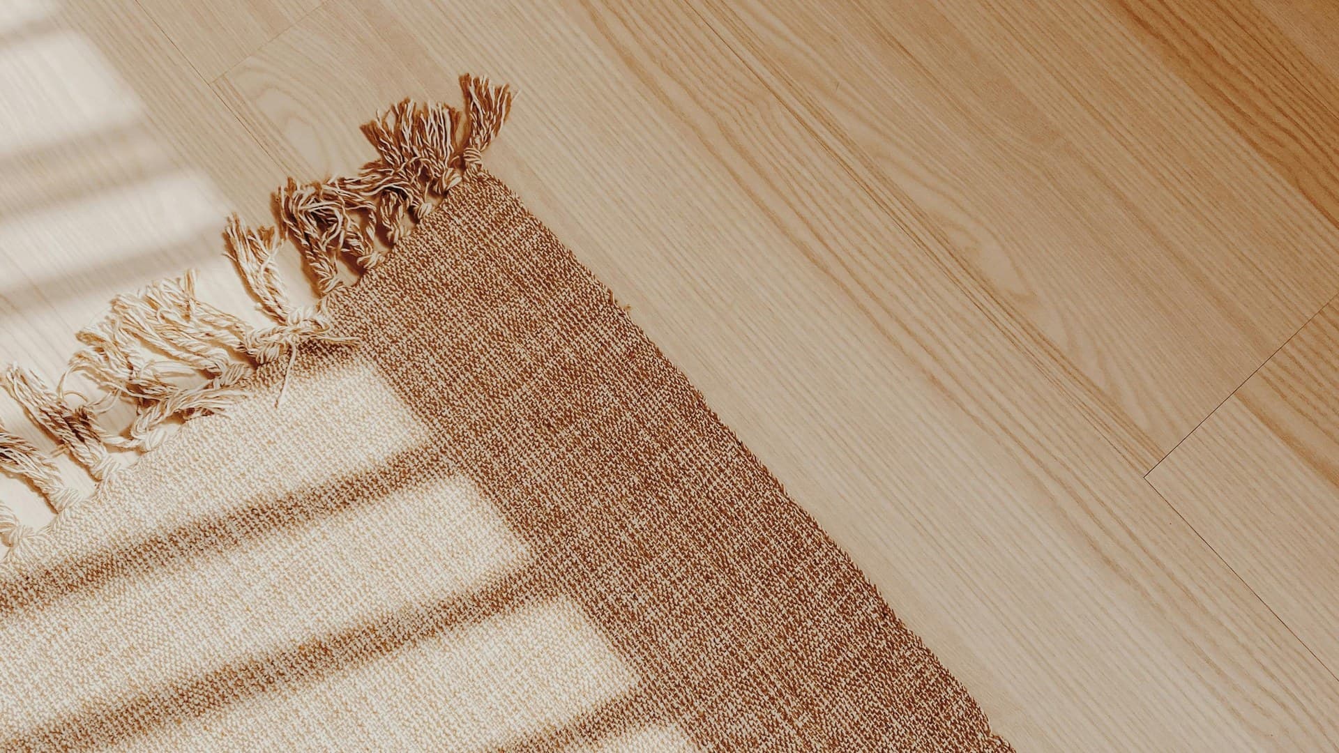 Warm timber floor in a sunlit room